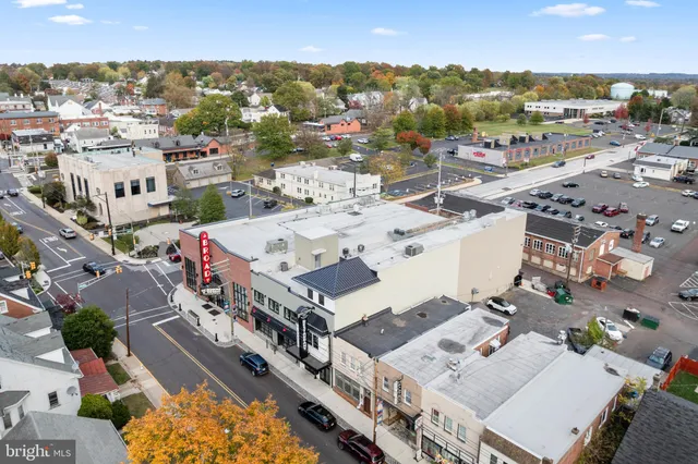 a front view of a house with retail shops