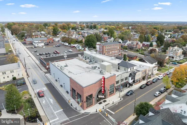 a picture of a bathroom with mirror and sink