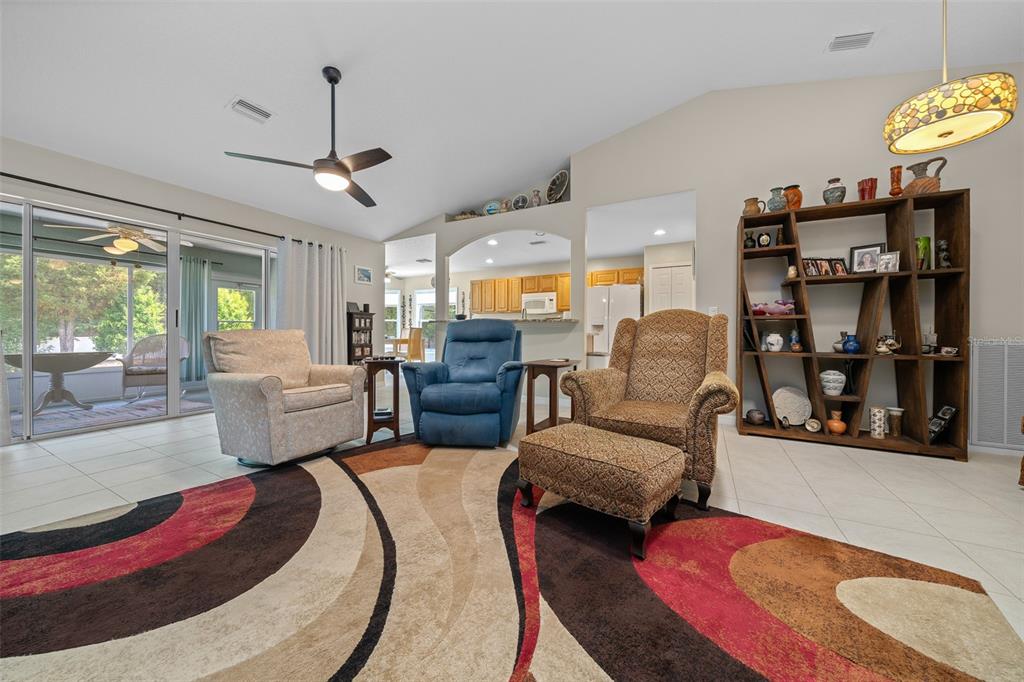 16193 Southwest 14th Avenue Road Ocala, FL 34473 - Photo 18 of 74 a living room with furniture fireplace and a chandelier