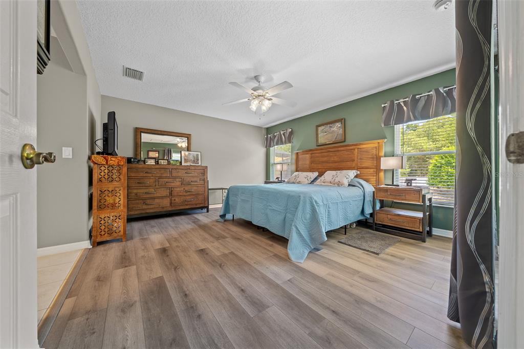 16193 Southwest 14th Avenue Road Ocala, FL 34473 - Photo 33 of 74 a bedroom with a bed and a large window