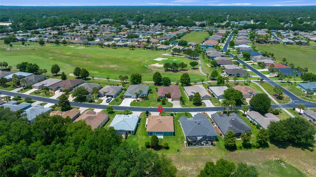 16193 Southwest 14th Avenue Road Ocala, FL 34473 - Photo 56 of 74 an aerial view of residential houses with outdoor space and trees