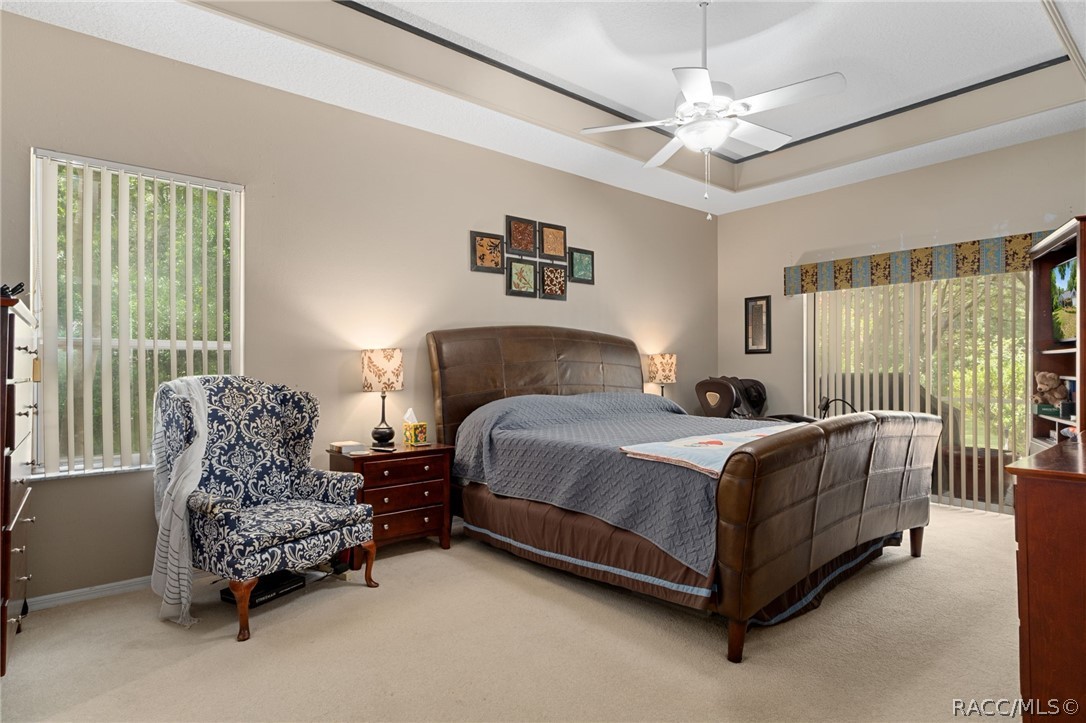 2460 West Pine Ridge Boulevard Beverly Hills, FL 34465 - Photo 19 of 47 a bedroom with a bed mirror and window
