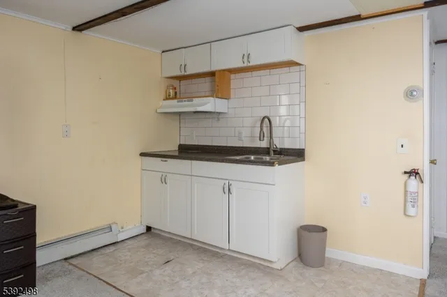 a white toilet sitting next to a bathroom sink