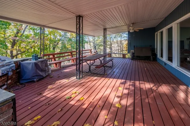 a sitting area with view of a roof deck