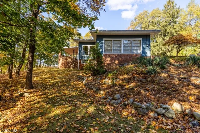 a view of a house with a tree
