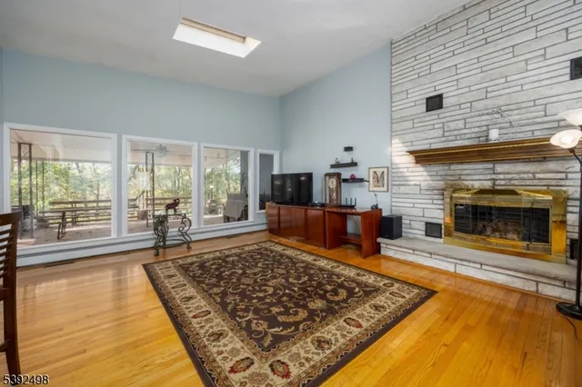 a living room with furniture rug and a fireplace