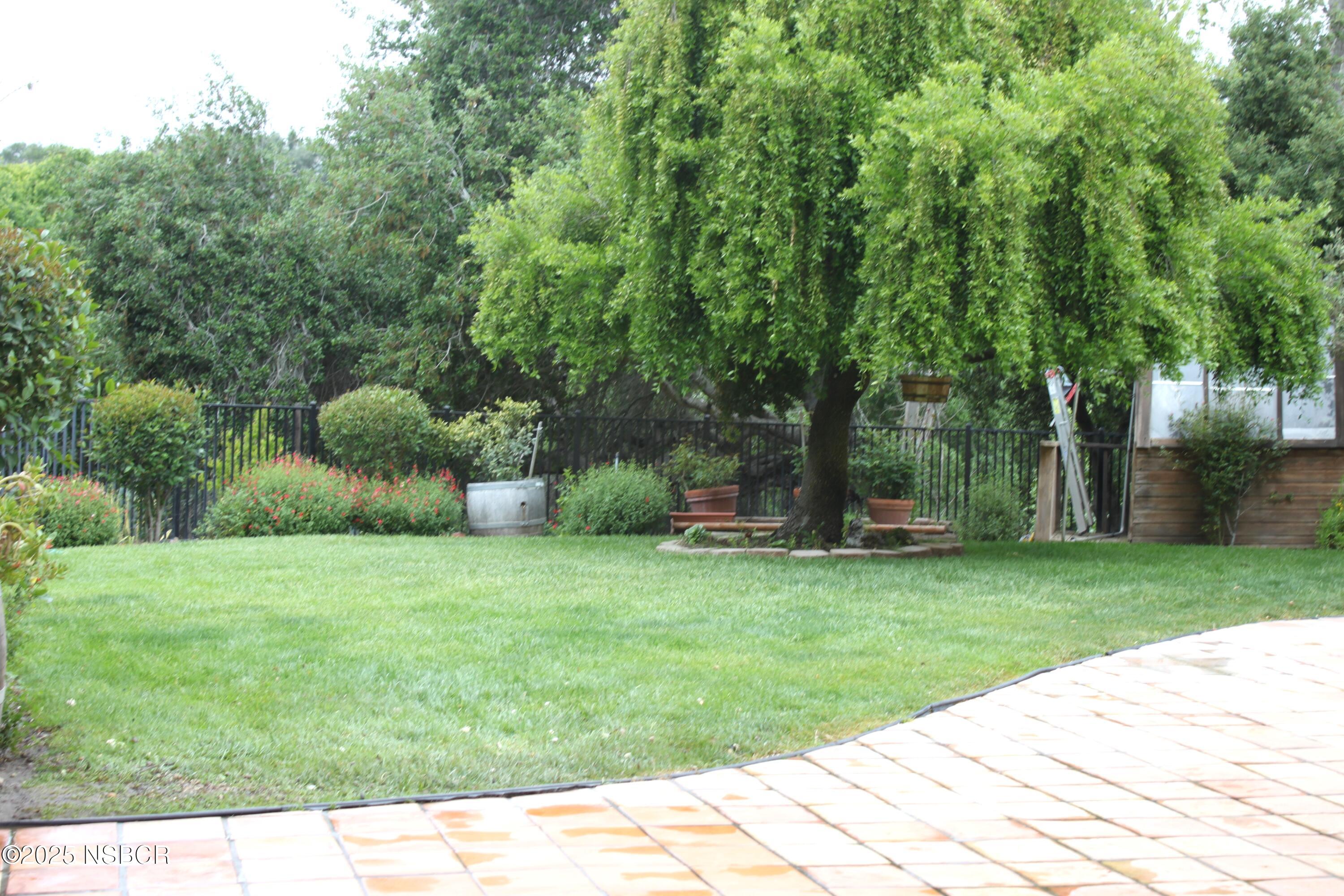 1448 Holsted Drive Solvang, CA 93463 - Photo 27 of 33 a backyard of a house with lots of green space