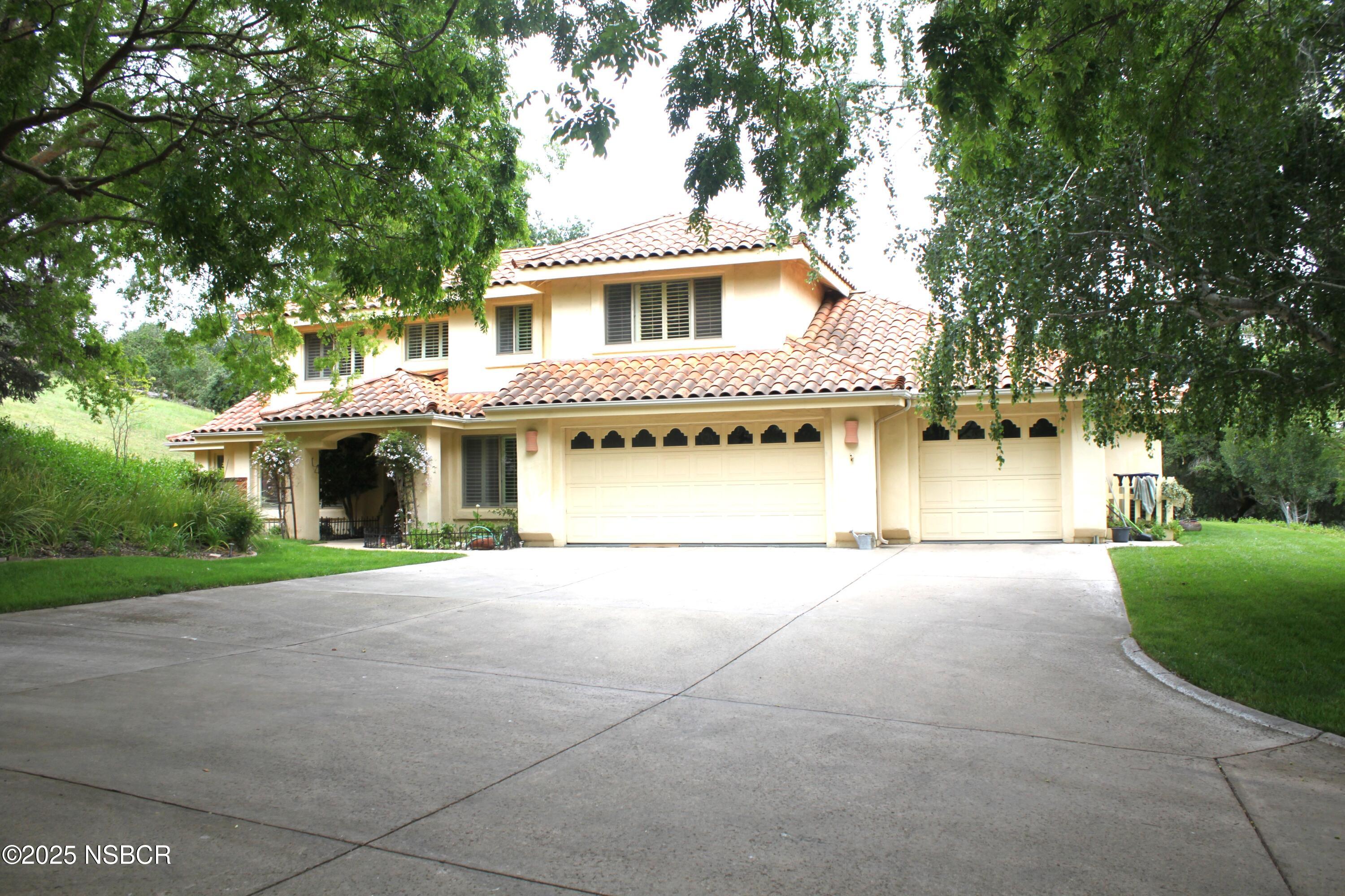 1448 Holsted Drive Solvang, CA 93463 - Photo 4 of 33 a front view of a house with a yard and garage