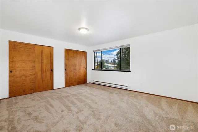 a view of an empty room with windows