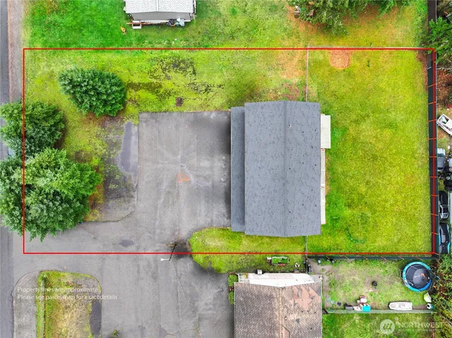 a view of a house with backyard porch and sitting area