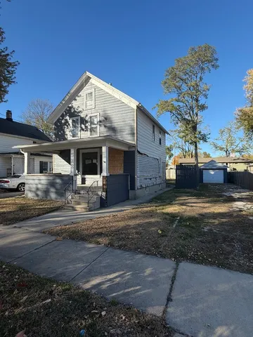 a view of a house next to a yard
