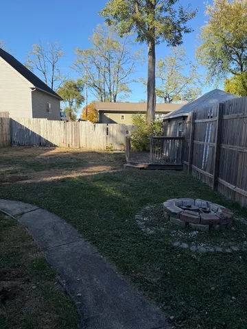 a front view of a house with garden and porch