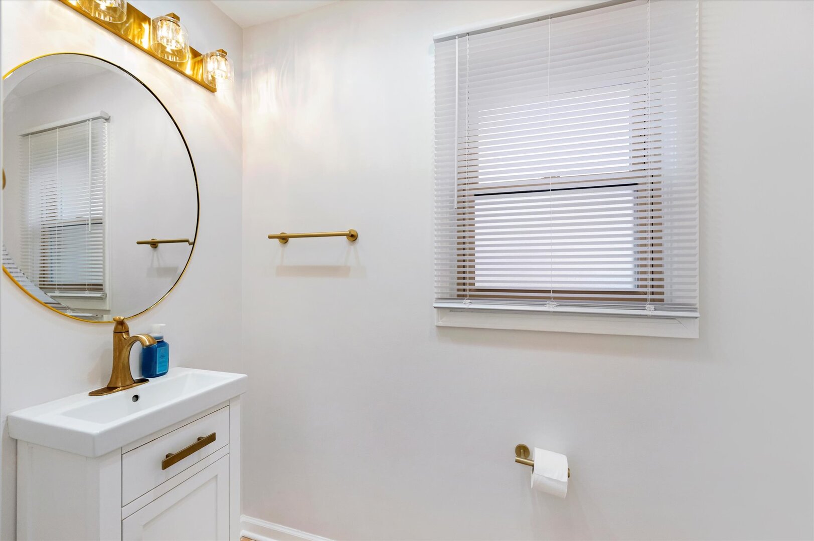 1319 West 32nd Place Chicago, IL 60608 - Photo 11 of 46 a bathroom with a sink a mirror and vanity