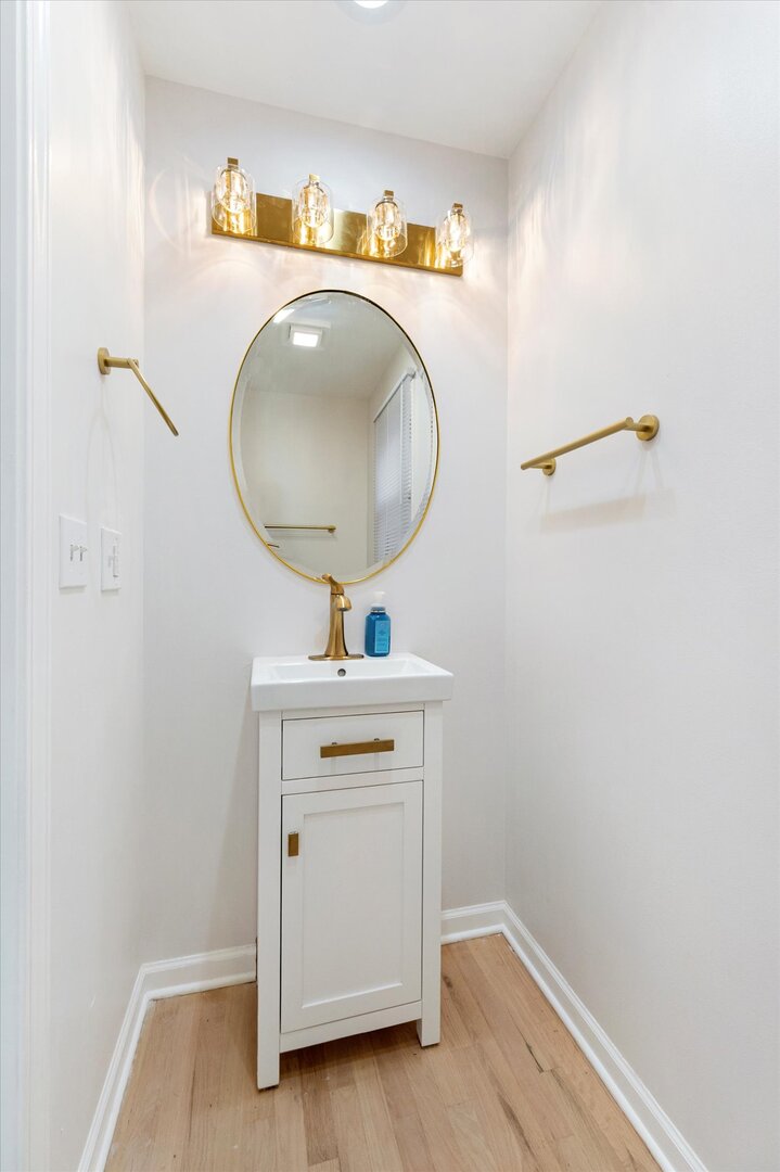 1319 West 32nd Place Chicago, IL 60608 - Photo 13 of 46 a bathroom with a sink and a mirror