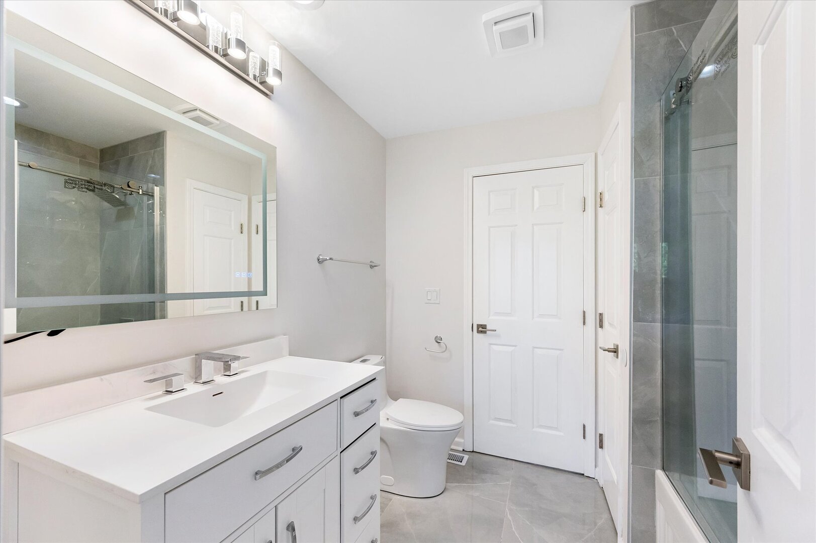 1319 West 32nd Place Chicago, IL 60608 - Photo 24 of 46 a bathroom with a sink a toilet and shower