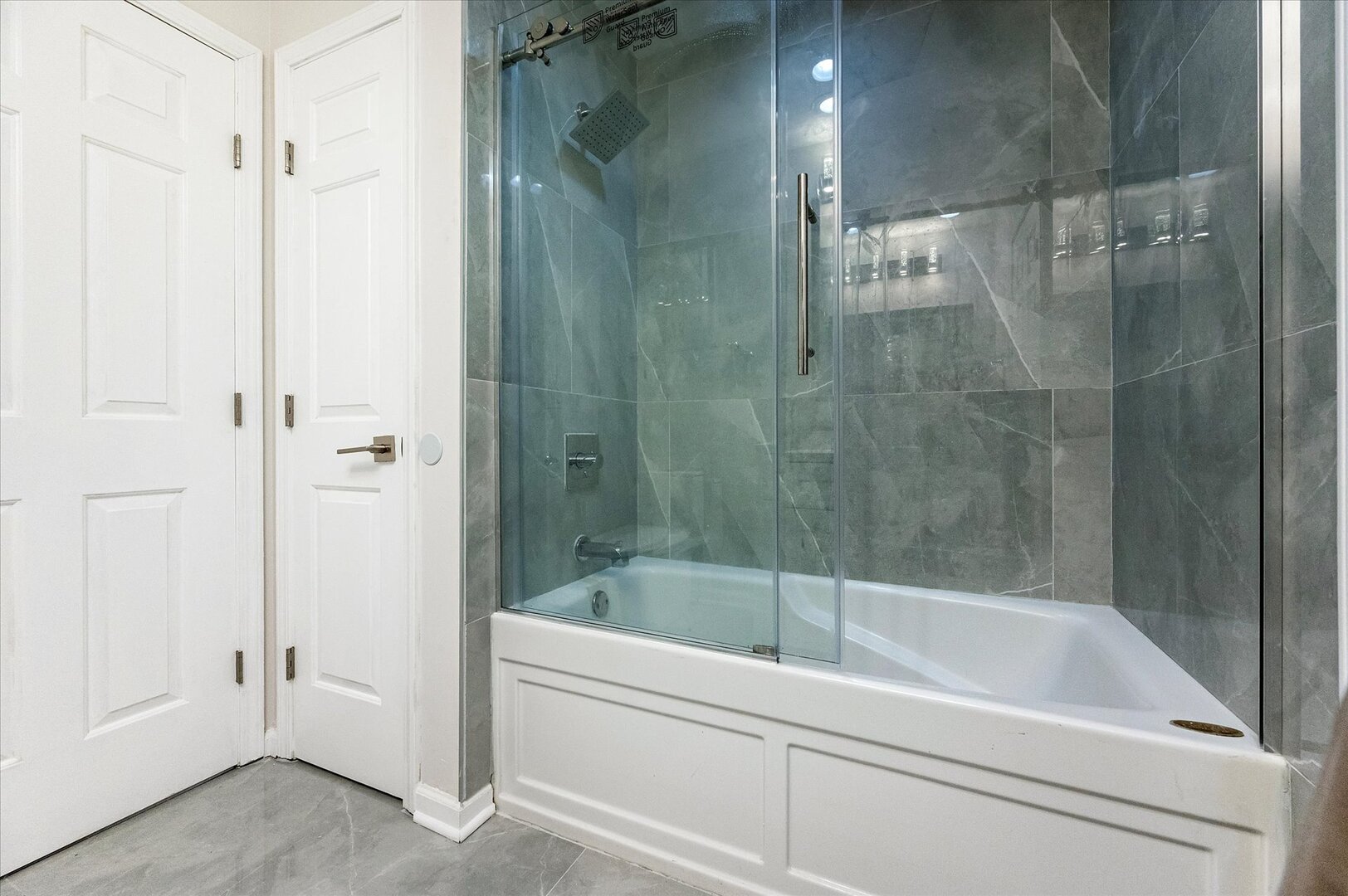 1319 West 32nd Place Chicago, IL 60608 - Photo 26 of 46 a white bath tub sitting next to a shower