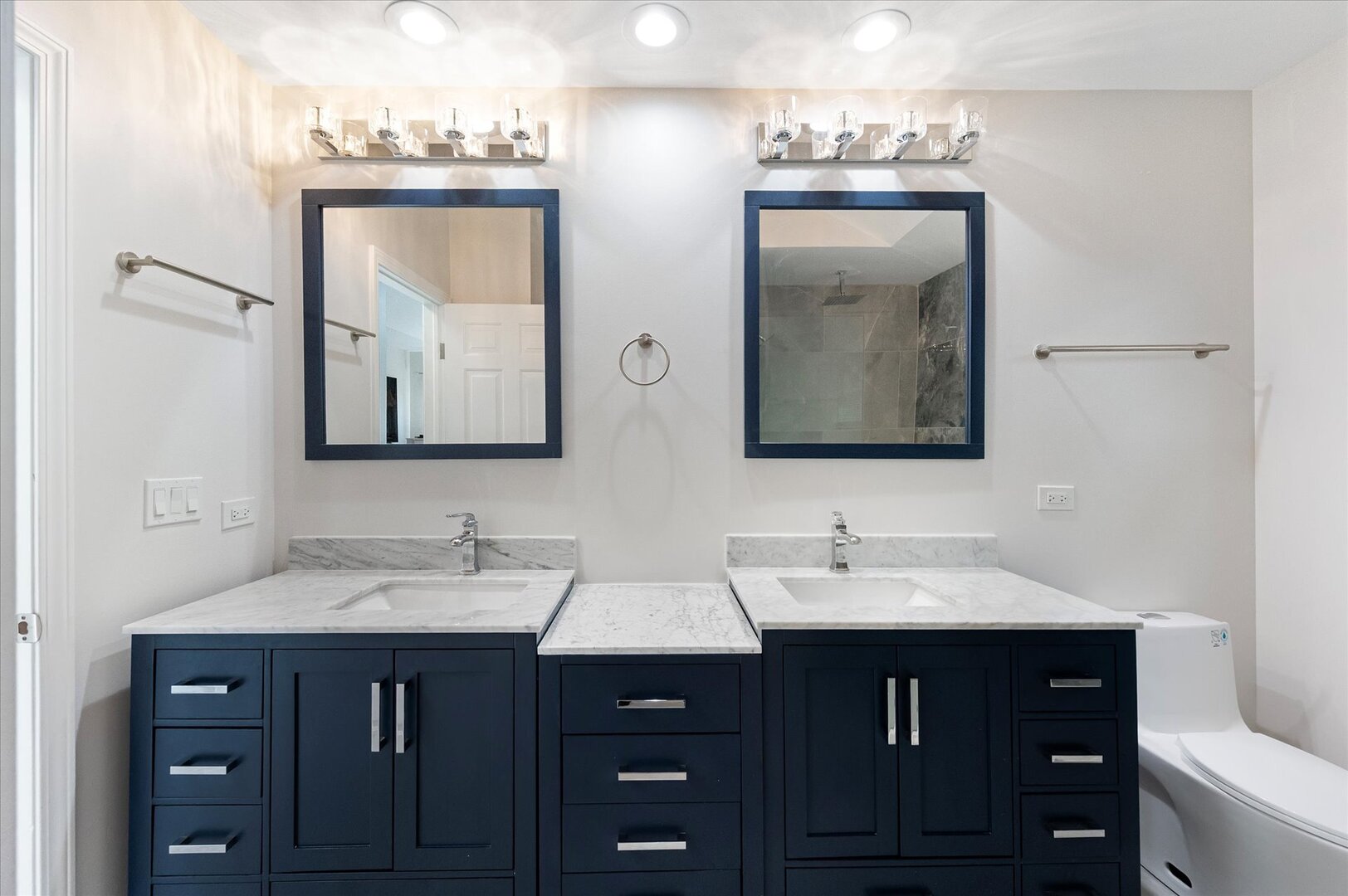 1319 West 32nd Place Chicago, IL 60608 - Photo 29 of 46 a bathroom with a double vanity sink and mirror