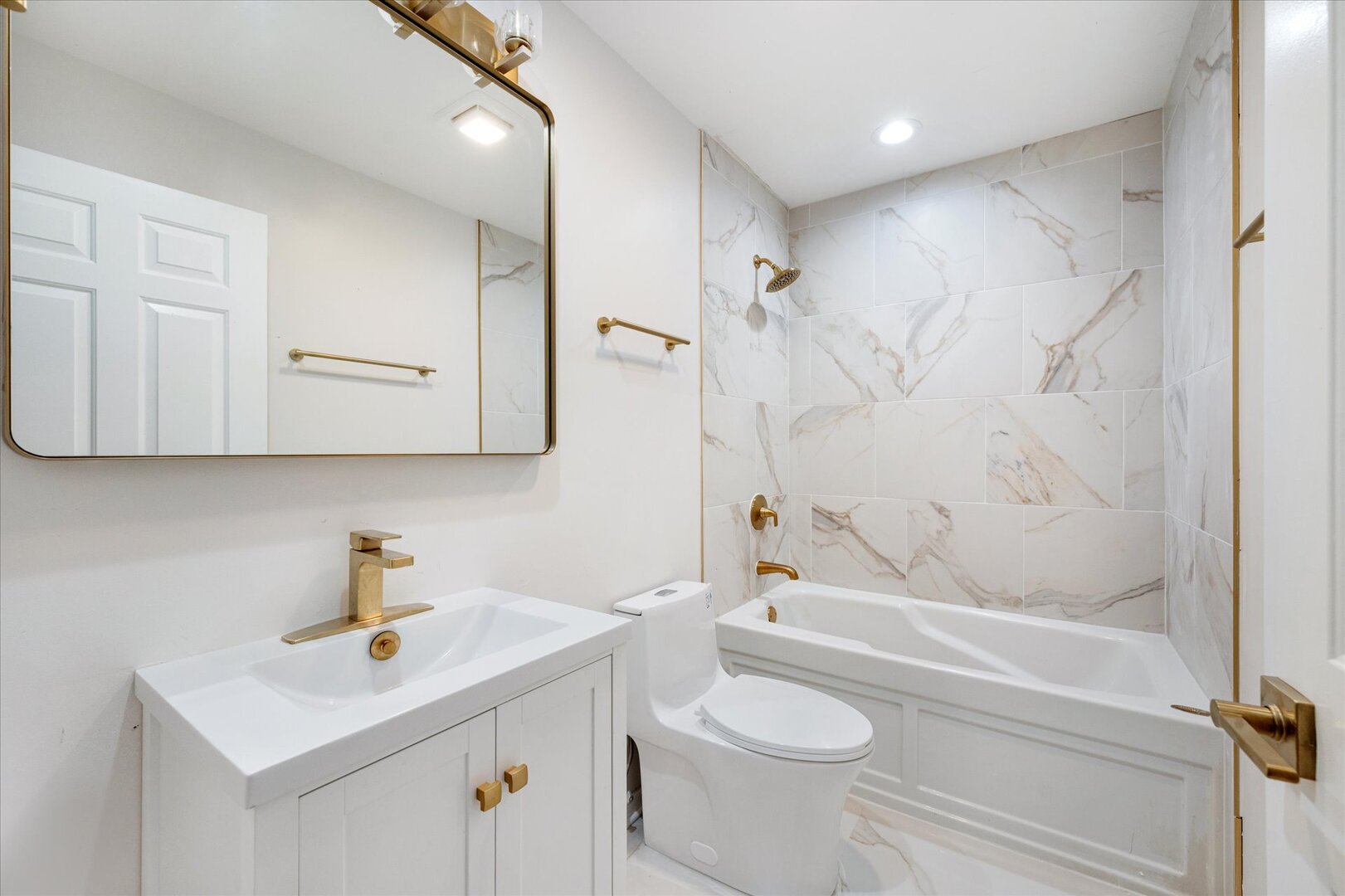 1319 West 32nd Place Chicago, IL 60608 - Photo 35 of 46 a bathroom with a sink a toilet and shower
