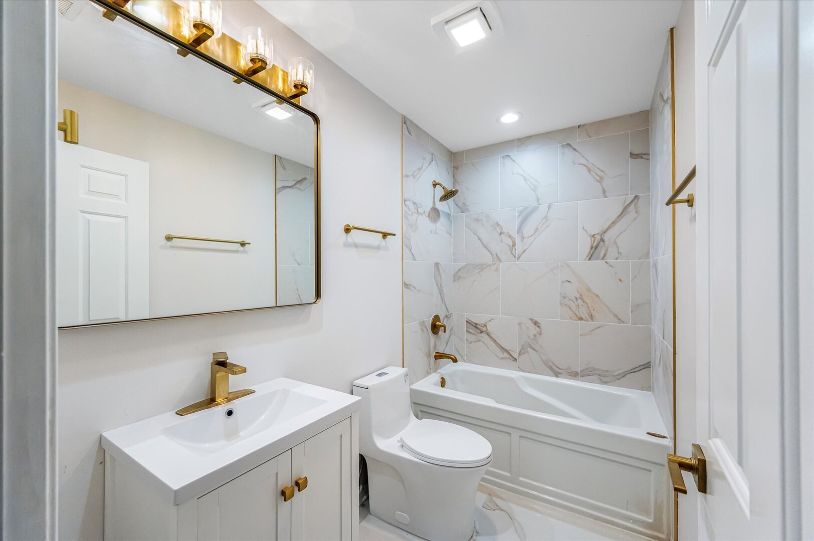 1319 West 32nd Place Chicago, IL 60608 - Photo 37 of 46 a bathroom with a sink a toilet and shower
