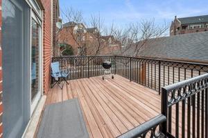 1319 West 32nd Place Chicago, IL 60608 - Photo 39 of 46 a balcony with wooden floor