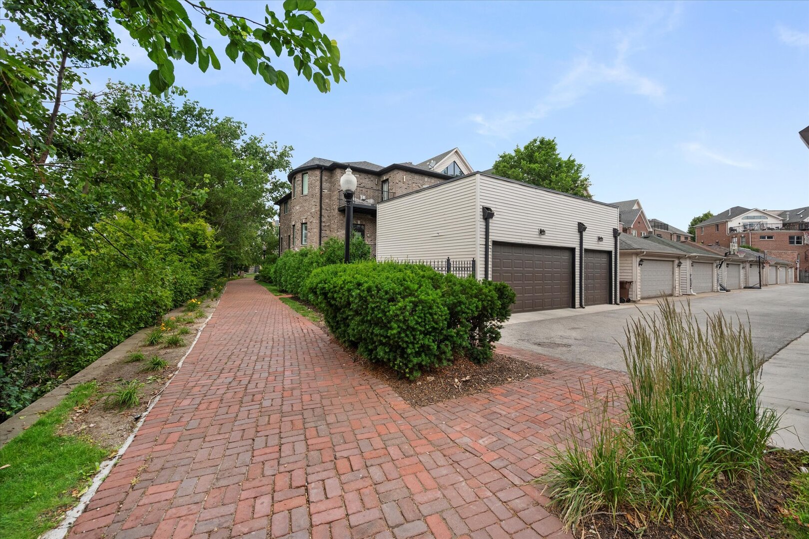 1319 West 32nd Place Chicago, IL 60608 - Photo 44 of 46 a view of a small white house with a small yard and a large tree
