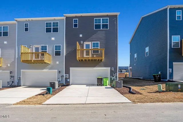 a brick building with a couple of cars parked in front of it