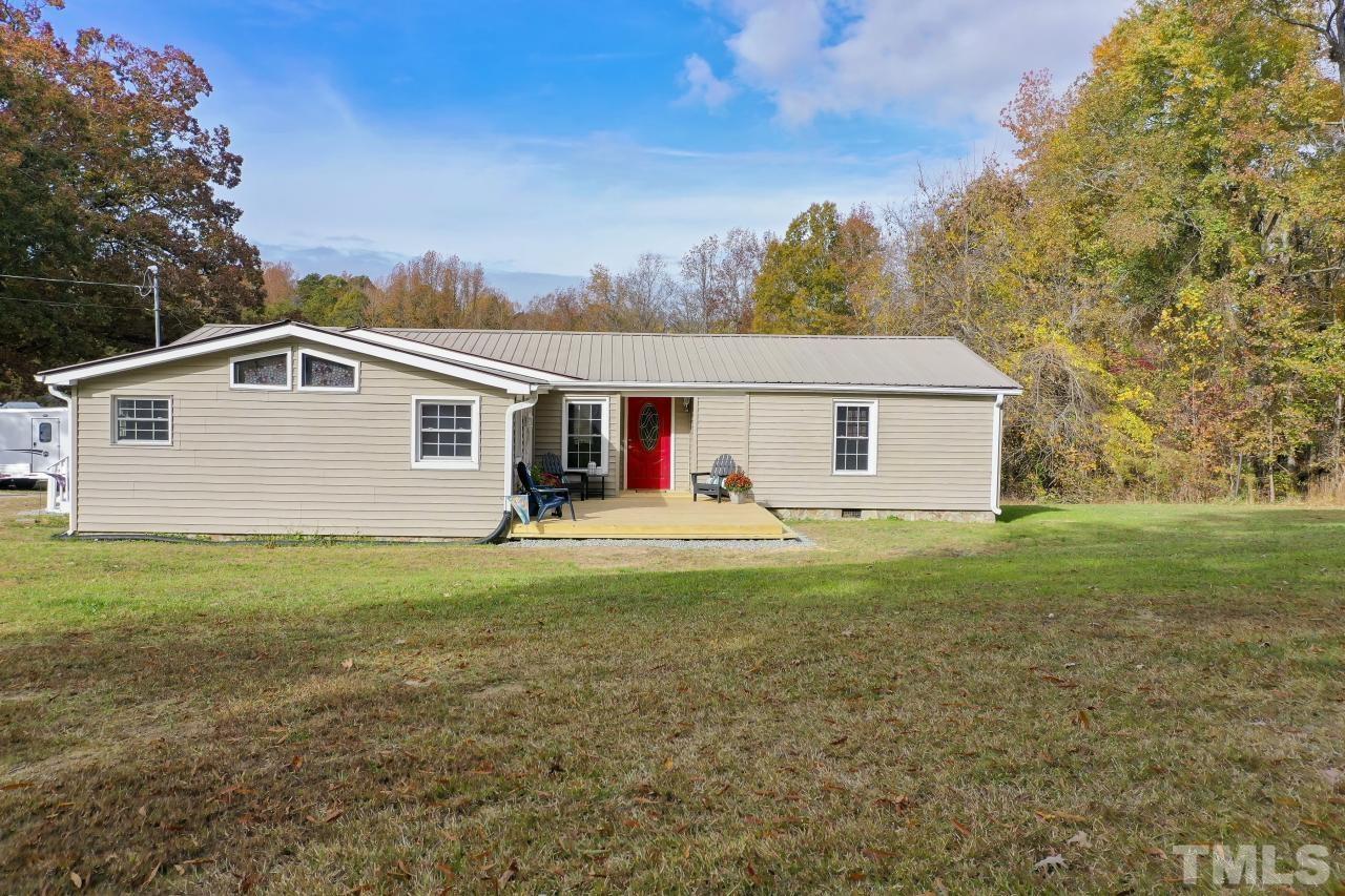 1231 Stoney Mountain Road Rougemont, NC 27572 - Photo 2 of 45 a front view of house with yard and trees