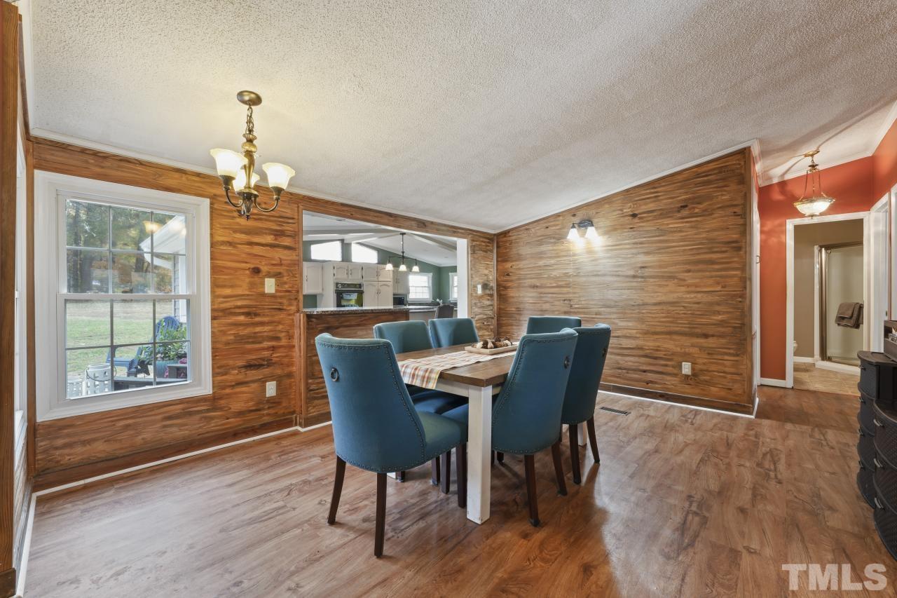1231 Stoney Mountain Road Rougemont, NC 27572 - Photo 23 of 45 a view of a dining room with furniture window and wooden floor