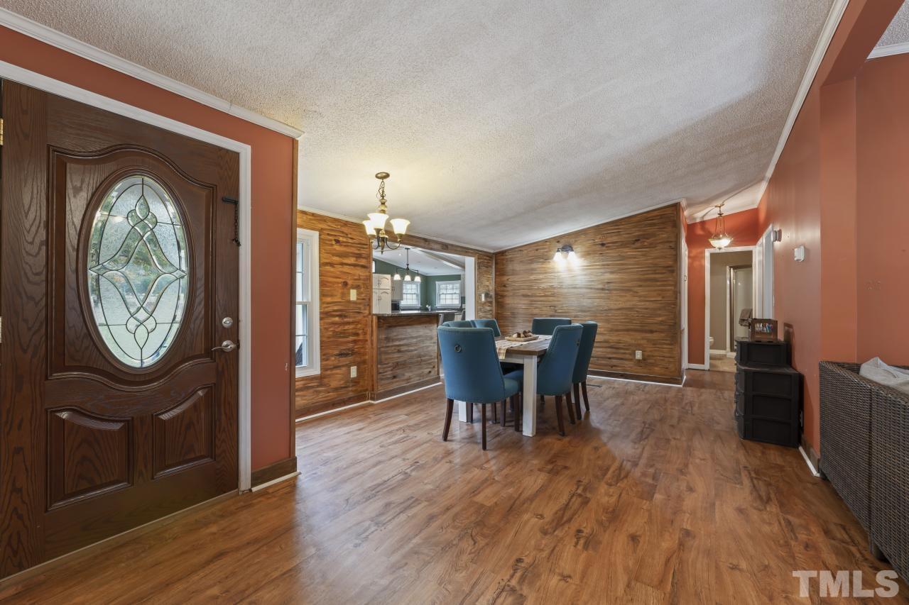 1231 Stoney Mountain Road Rougemont, NC 27572 - Photo 30 of 45 a view of a dining room with furniture window and wooden floor
