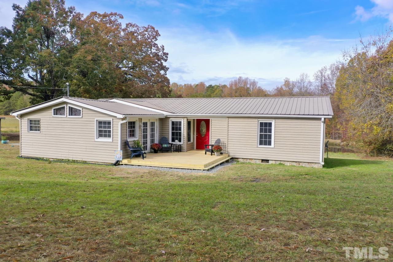 1231 Stoney Mountain Road Rougemont, NC 27572 - Photo 3 of 45 a view of a house with a backyard