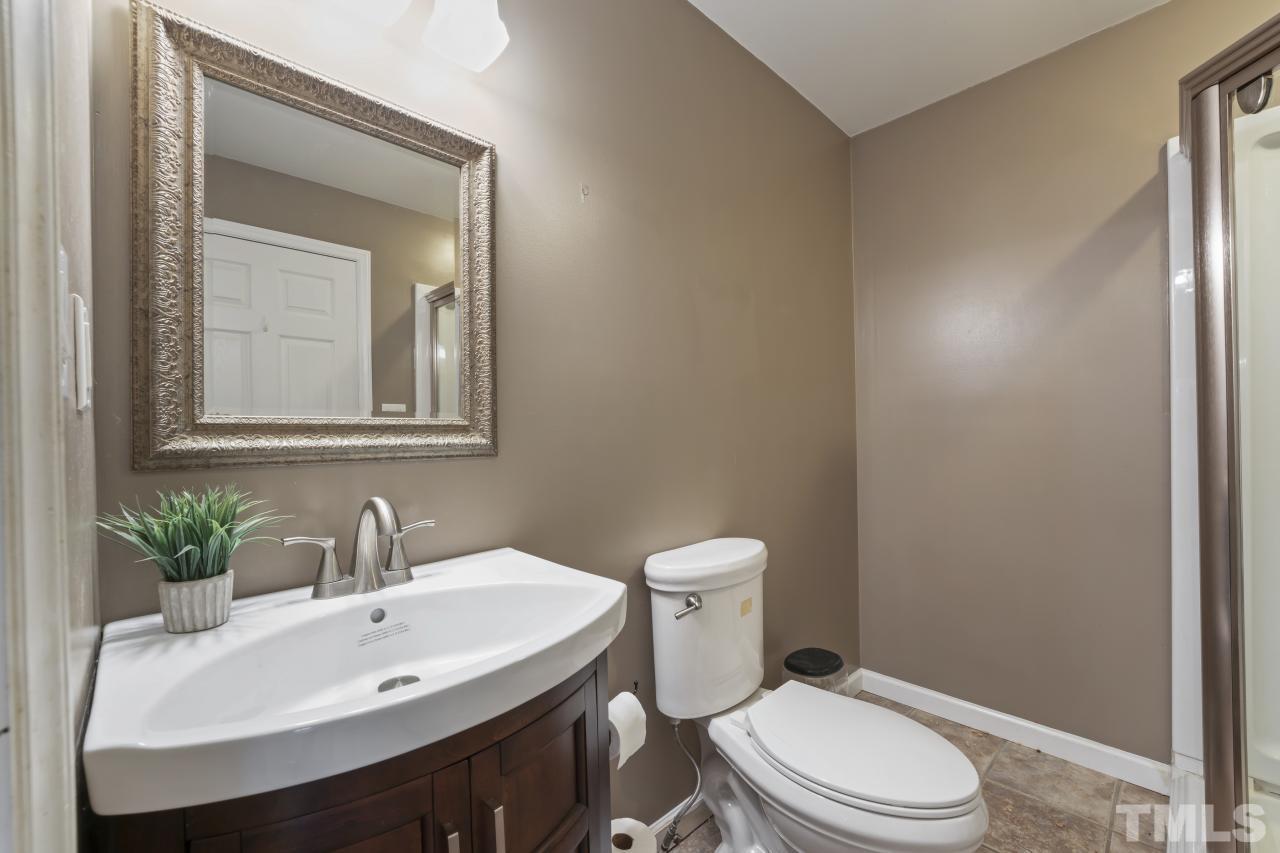 1231 Stoney Mountain Road Rougemont, NC 27572 - Photo 34 of 45 a bathroom with a sink toilet and mirror