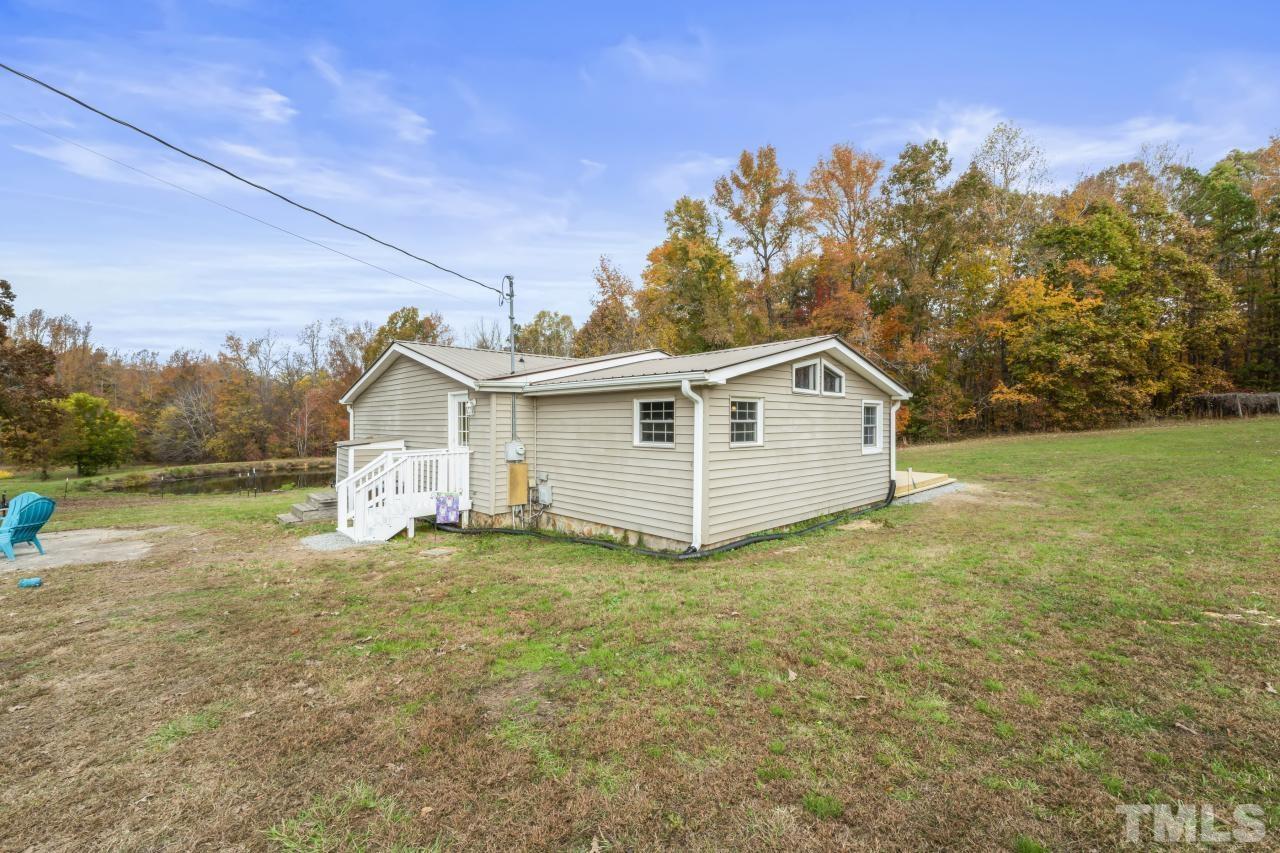 1231 Stoney Mountain Road Rougemont, NC 27572 - Photo 36 of 45 a view of a house with a yard
