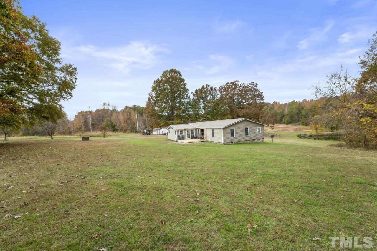 1231 Stoney Mountain Road Rougemont, NC 27572 - Photo 38 of 45 a view of a house with a yard