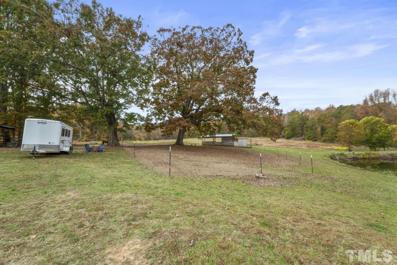 1231 Stoney Mountain Road Rougemont, NC 27572 - Photo 40 of 45 a view of a lake with a yard