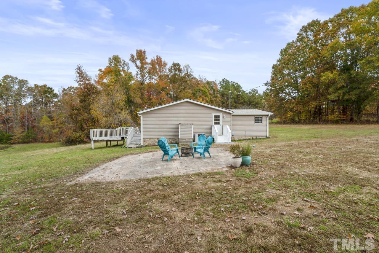 1231 Stoney Mountain Road Rougemont, NC 27572 - Photo 42 of 45 a front view of a house with garden