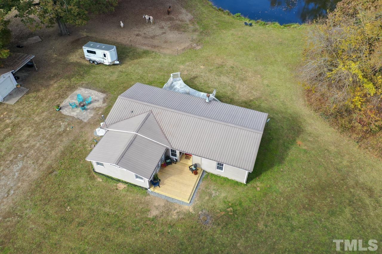1231 Stoney Mountain Road Rougemont, NC 27572 - Photo 5 of 45 an aerial view of a house with a yard and trees