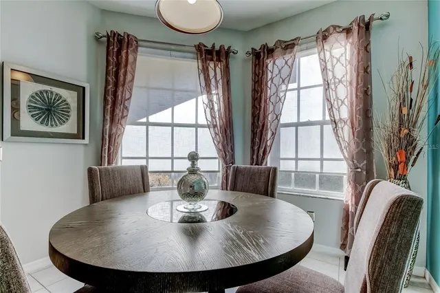 a kitchen with granite countertop white cabinets and stainless steel appliances