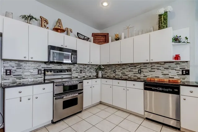 a living room with fireplace furniture and a window