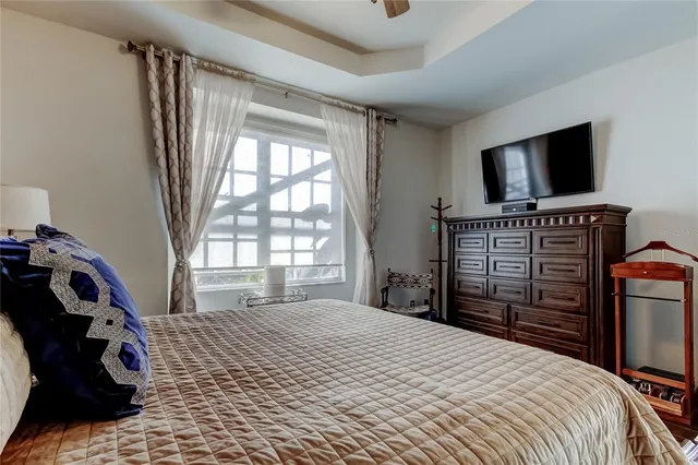 a living room with furniture and a book shelf