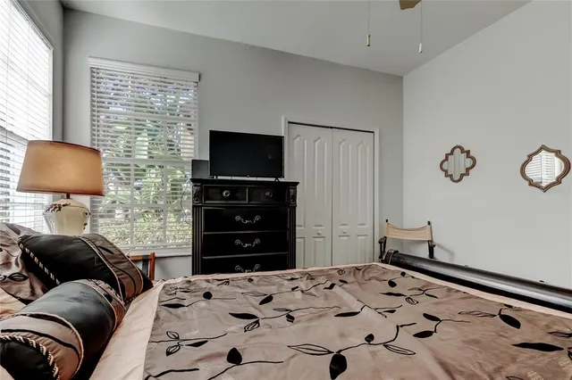 a view of a patio with table and chairs and potted plants