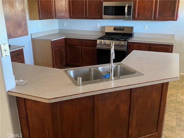 a kitchen with a sink and a stove