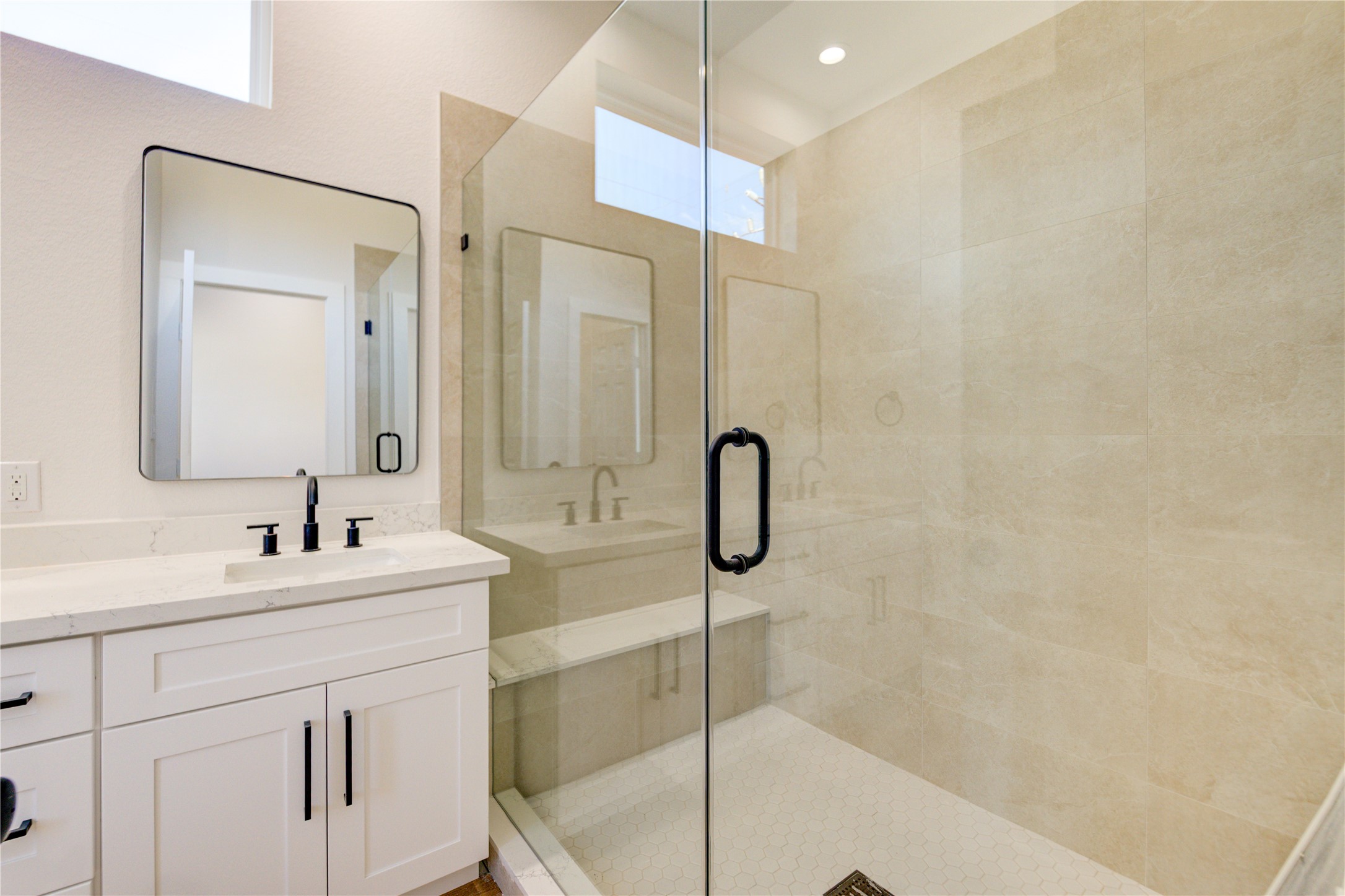 1211 Dewalt Street Houston, TX 77088 - Photo 14 of 28 a bathroom with a sink a toilet a mirror and shower