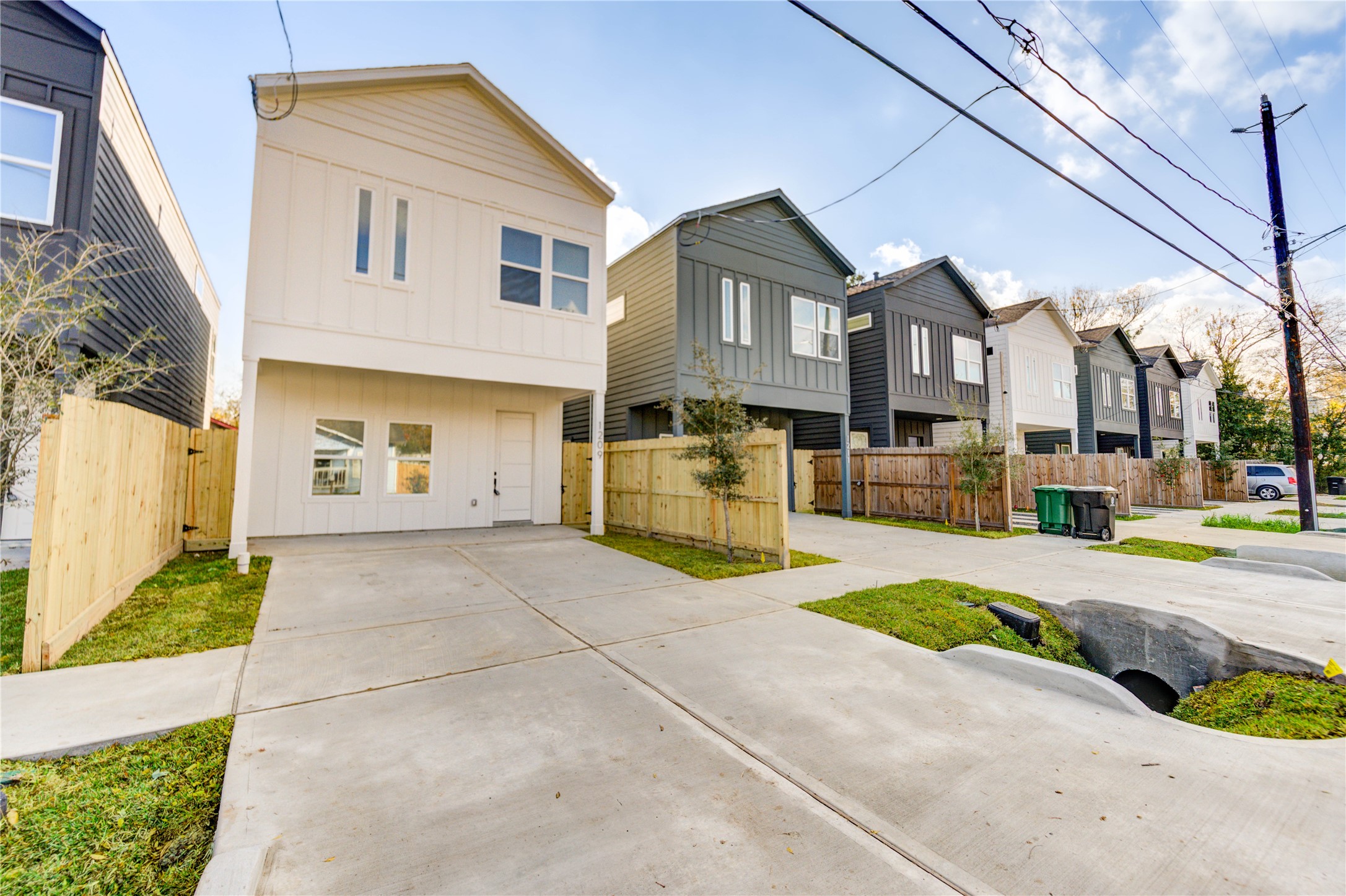 1211 Dewalt Street Houston, TX 77088 - Photo 2 of 28 a front view of a house with a yard and garage