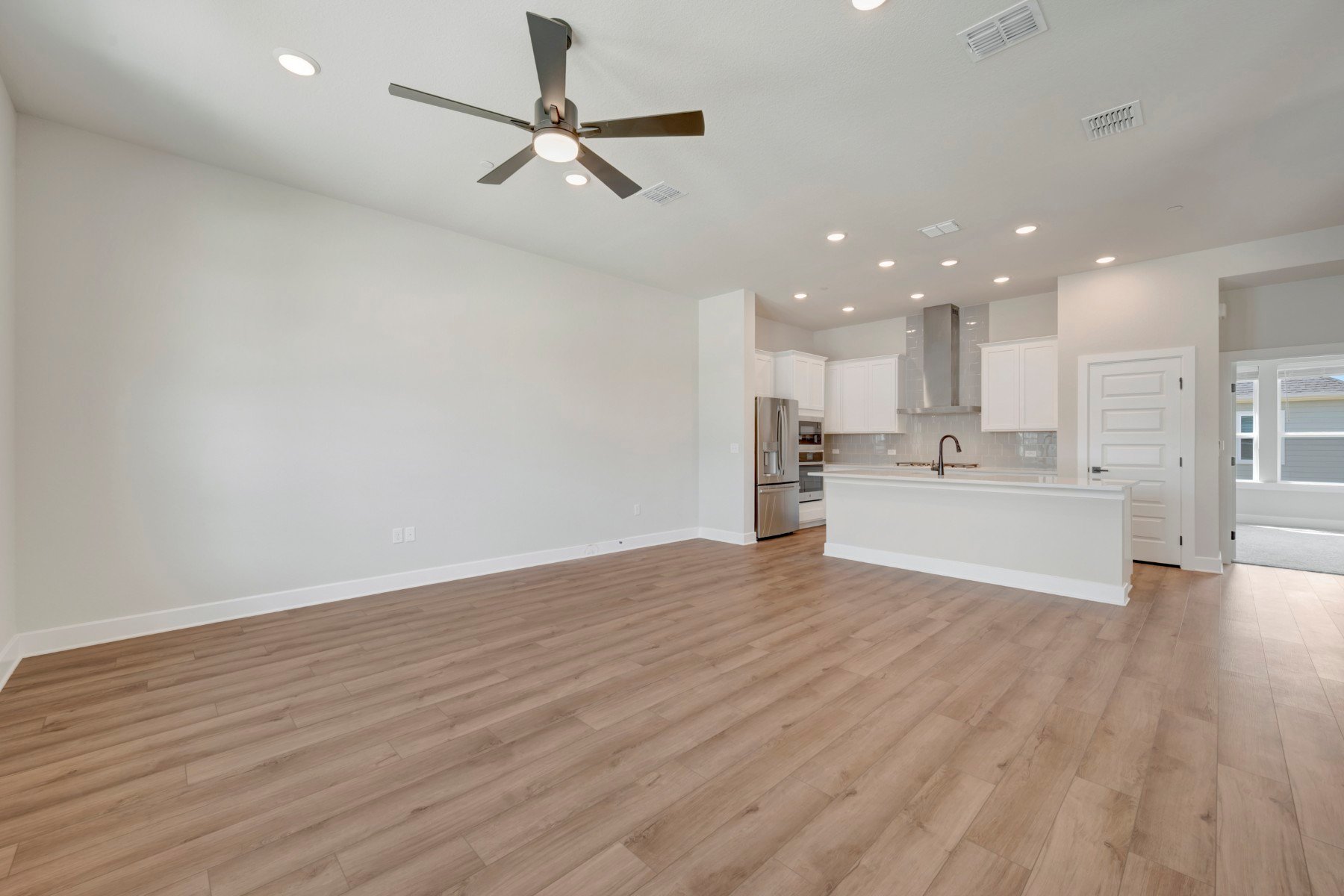 1017 Brickell Loop Austin, TX 78744 - Photo 10 of 31 Family Room - Kitchen