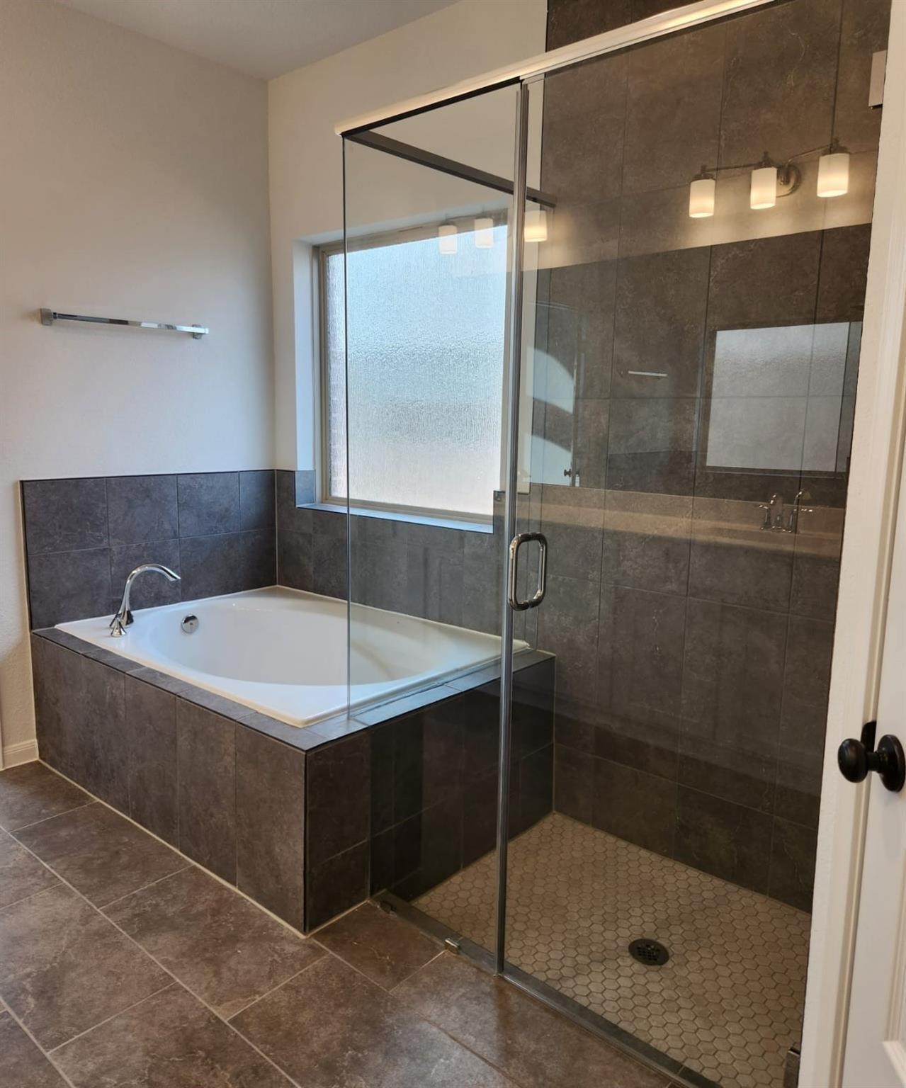 2419 Humble Way Rosenberg, TX 77471 - Photo 11 of 38 a bathroom with a bath tub and shower