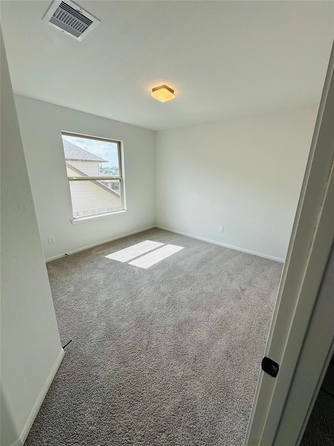 2419 Humble Way Rosenberg, TX 77471 - Photo 22 of 38 an empty room with windows