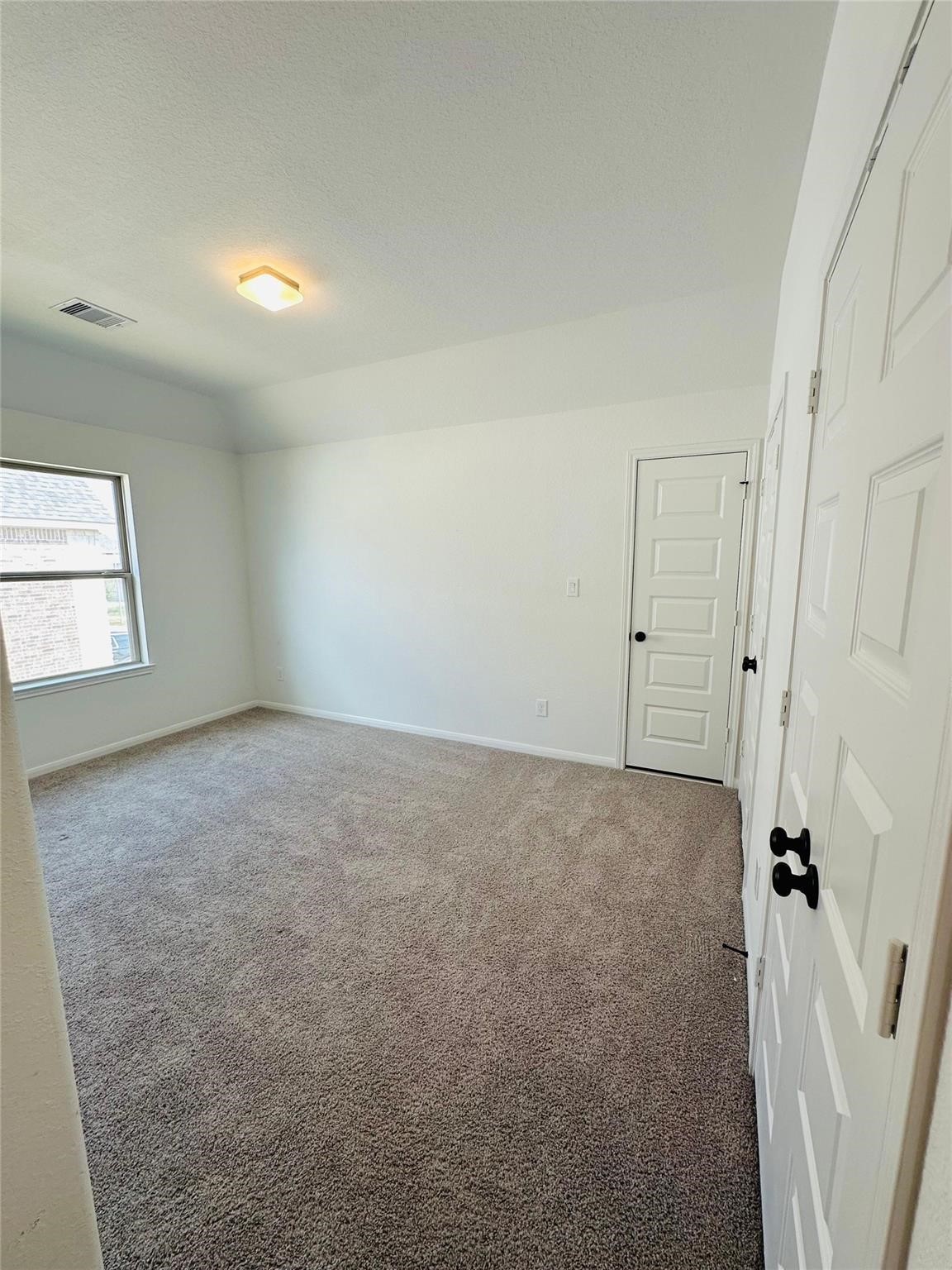 2419 Humble Way Rosenberg, TX 77471 - Photo 23 of 38 an empty room with windows