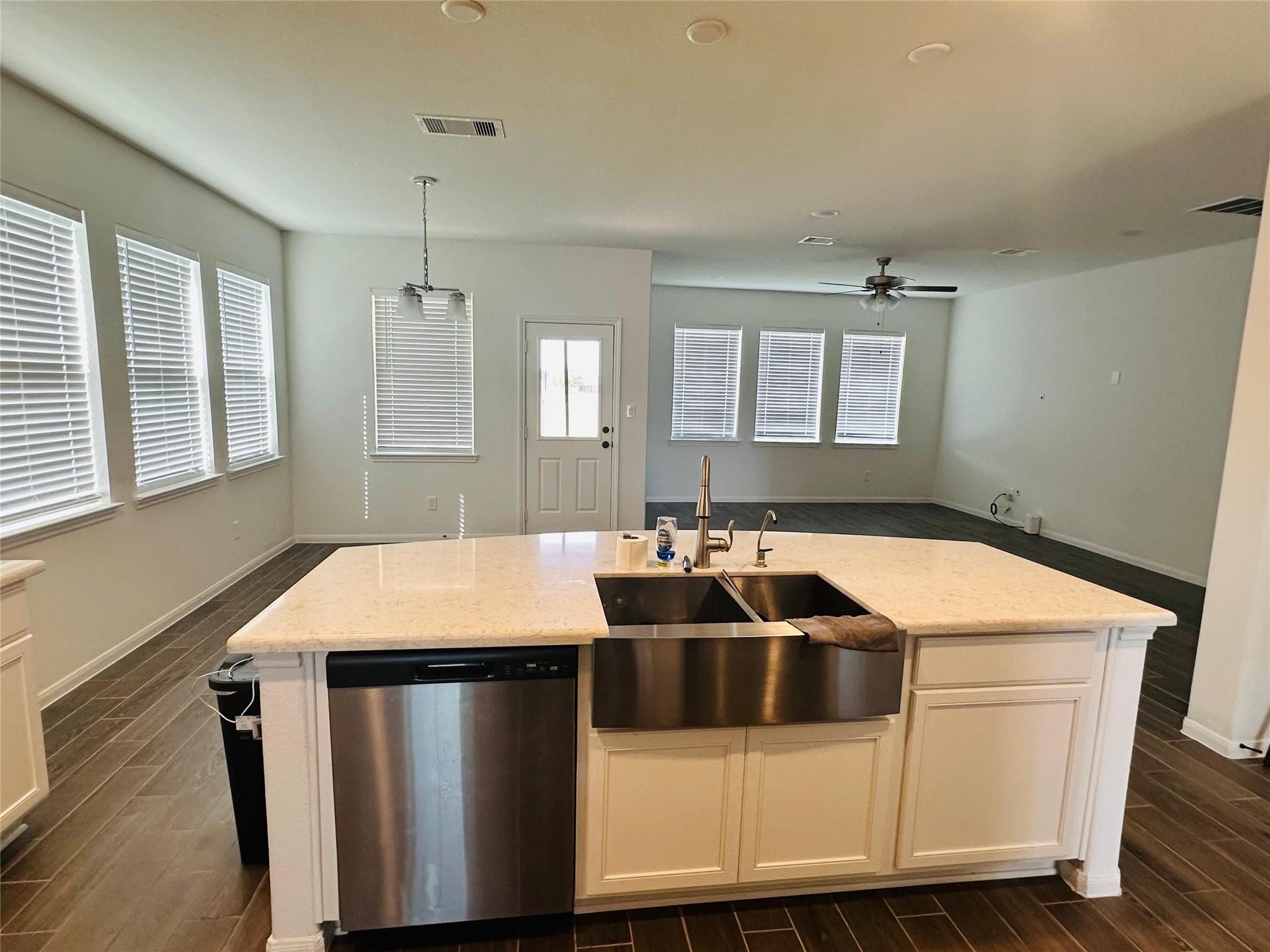 2419 Humble Way Rosenberg, TX 77471 - Photo 32 of 38 a kitchen with a sink a table and chairs