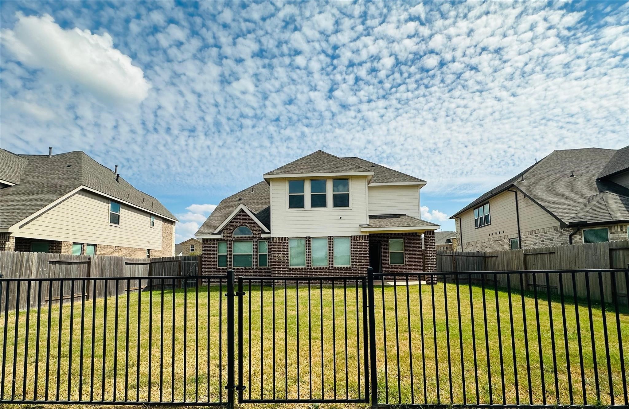 2419 Humble Way Rosenberg, TX 77471 - Photo 37 of 38 a view of a house with a wooden deck