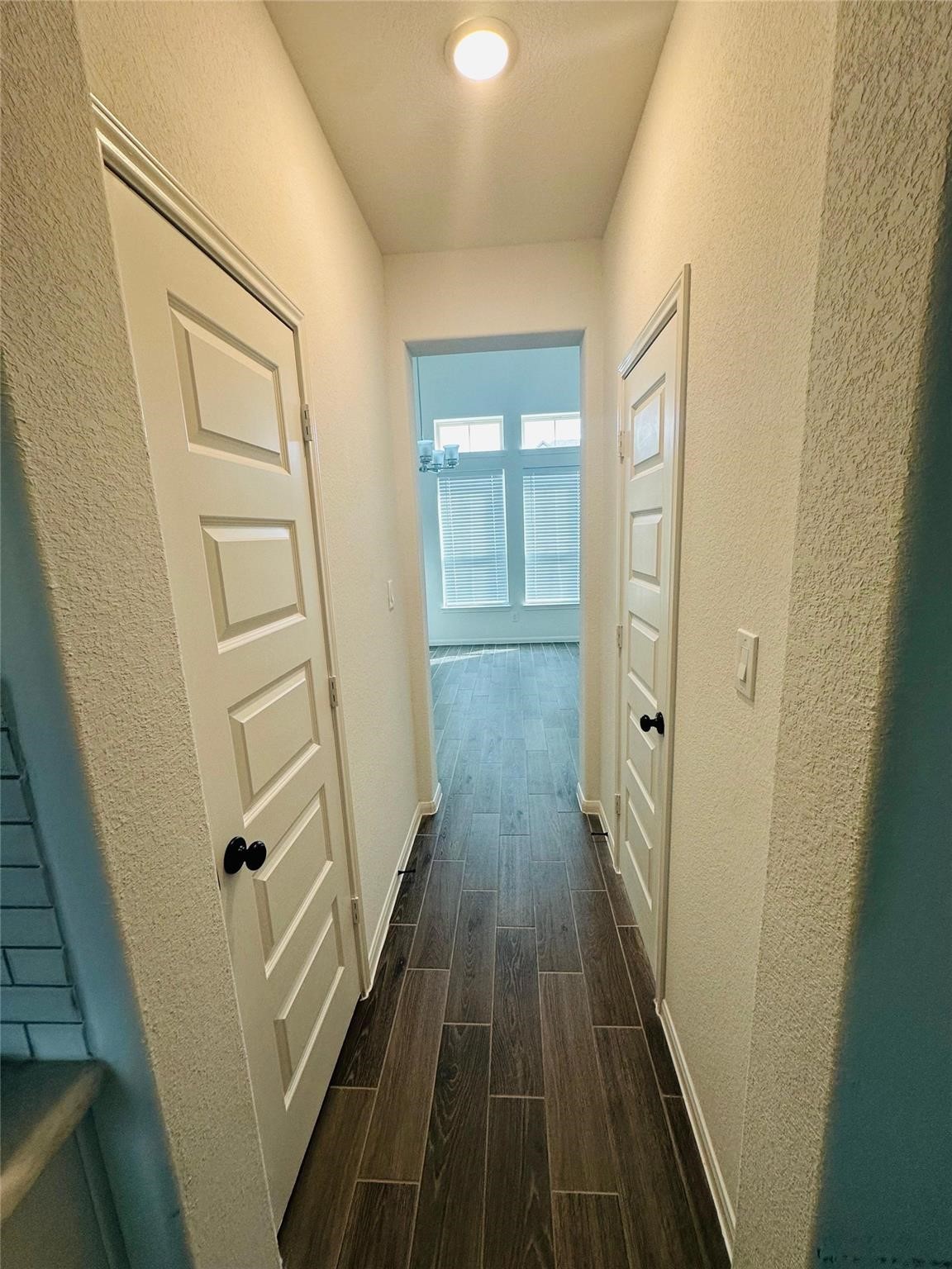2419 Humble Way Rosenberg, TX 77471 - Photo 4 of 38 a view of a hallway with wooden floor and staircase
